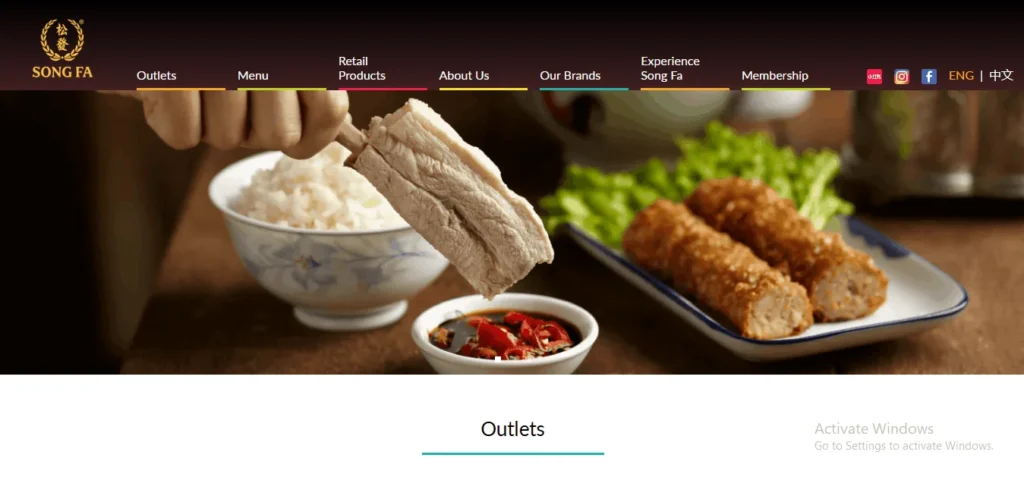 Song Fa Bak Kut Teh website homepage banner displaying a tender pork rib being dipped into chili soy sauce, served with a bowl of white rice and side dishes.