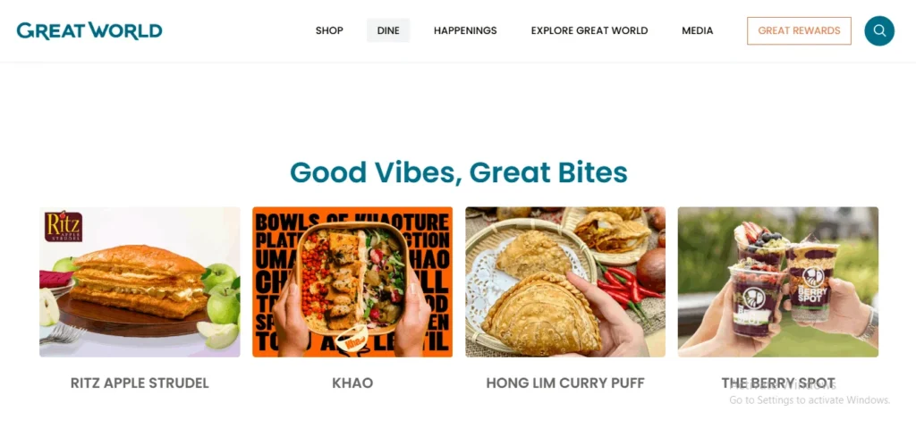 Screenshot of the Great World website’s "Good Vibes, Great Bites" dining section, featuring four food options: Ritz Apple Strudel, Khao, Hong Lim Curry Puff, and The Berry Spot.