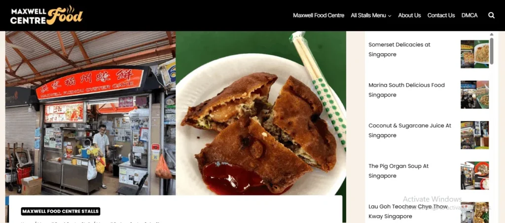 Website screenshot for Maxwell Food Centre displaying the Maxwell Fuzhou Oyster Cake stall on the left and a deep-fried oyster cake cut in half on a white plate on the right.