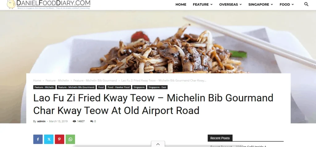 DanielFoodDiary.com blog post header displaying the logo and navigation menu above a featured image of stir-fried Char Kway Teow with bean sprouts and chopsticks. White article text overlay reads "Lao Fu Zi Fried Kway Teow – Michelin Bib Gourmand Char Kway Teow At Old Airport Road."