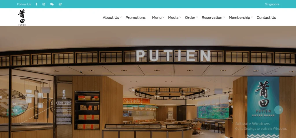 A screenshot of the Putien restaurant website homepage, showing a white navigation menu at the top and a large banner image of the restaurant's modern storefront entrance.