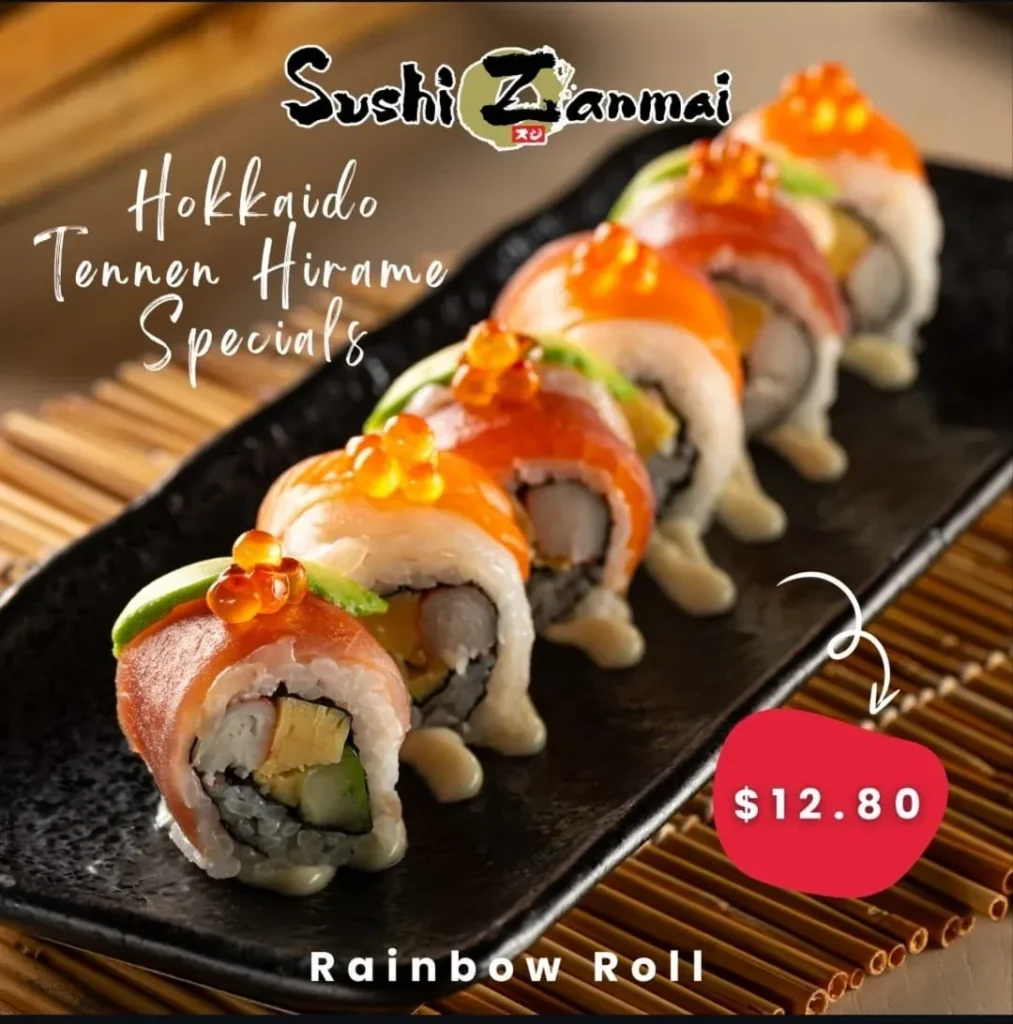 A promotional graphic from Sushi Zanmai featuring a line of "Rainbow Roll" sushi on a black platter, priced at $12.80 as part of the Hokkaido Tennen Hirame Specials.
