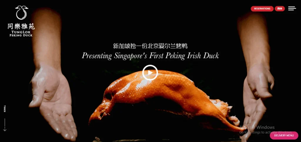 A roasted Peking duck with crispy, golden-brown skin centered on a dark background, flanked by a pair of open hands framing it. The TungLok Peking Duck logo is in the top left, with the text "Presenting Singapore's First Peking Irish Duck."