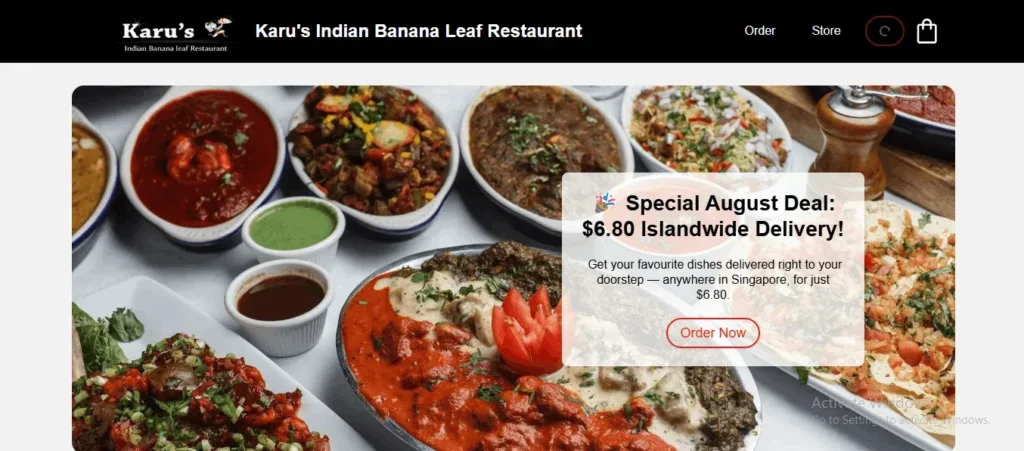 A screenshot of the homepage for Karu's Indian Banana Leaf Restaurant. The main banner image features an assortment of colorful Indian dishes and curries served in oval platters and bowls. An overlay box advertises a "Special August Deal: $6.80 Islandwide Delivery" with an "Order Now" call-to-action button.