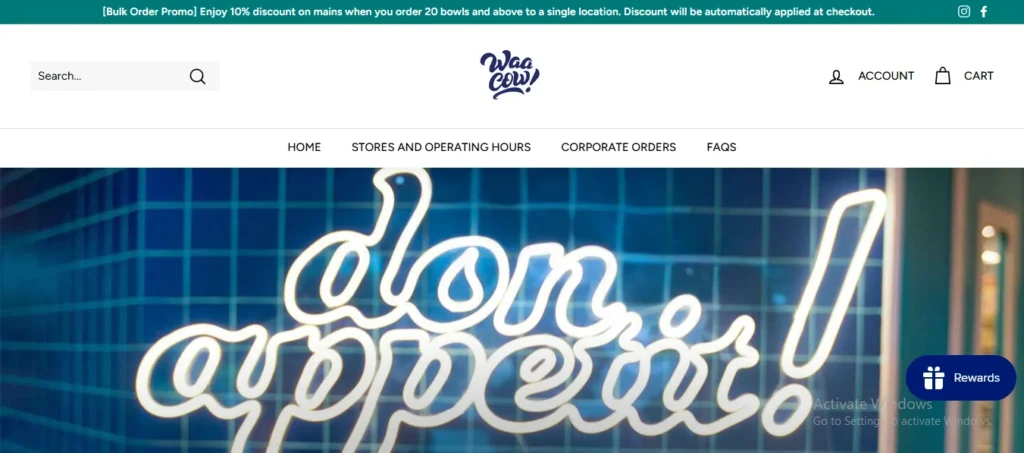 Waa Cow homepage banner displaying a glowing neon sign reading "don appetit!" against a blue tiled background.