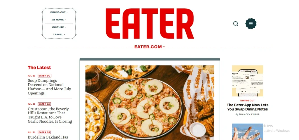 Screenshot of the Eater homepage featuring a bold red logo, recent food news headlines, and a main article highlighting pizzas topped with pineapple and jalapeños.