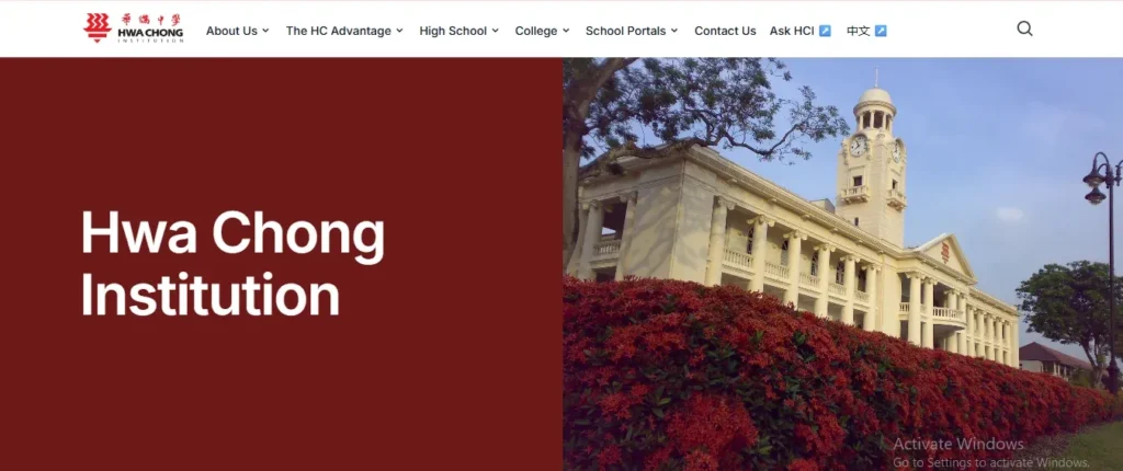 Homepage header for the Hwa Chong Institution website featuring the school name set against a maroon background alongside a photo of the iconic historic clock tower building framed by red flowering hedges.
