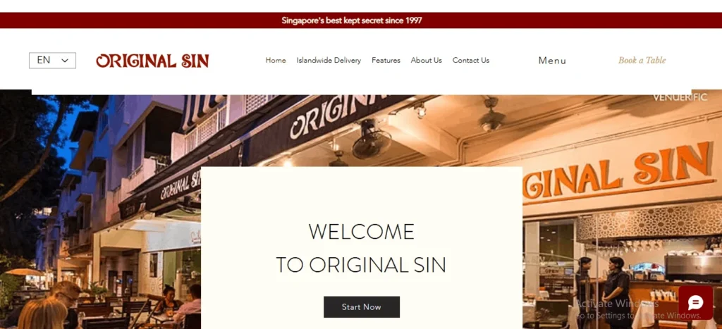 Website homepage for Original Sin restaurant featuring a banner image of the restaurant's exterior at night and a central welcome overlay.