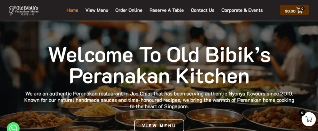 Website hero banner for Old Bibik’s Peranakan Kitchen featuring restaurant navigation links, a prominent heading, and descriptive text over a blurred background of Peranakan dishes.