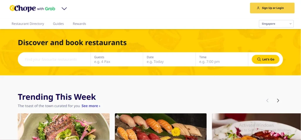 Chope with Grab homepage featuring a yellow search banner to discover and book restaurants in Singapore, with a Trending This Week section displaying gourmet food dishes.
