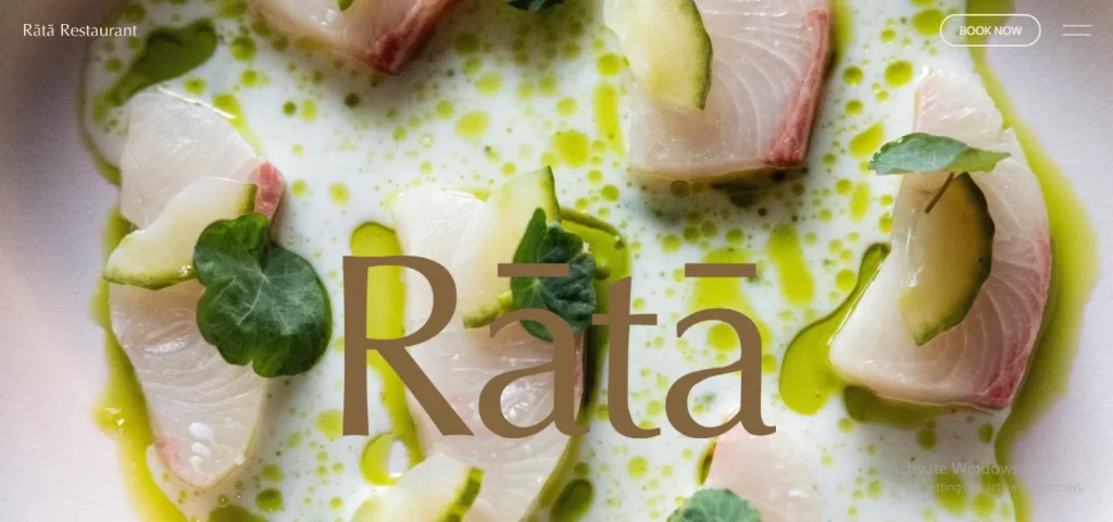 Fresh fish crudo dish garnished with microgreens, cucumber, and green oil sauce at Rātā Restaurant.