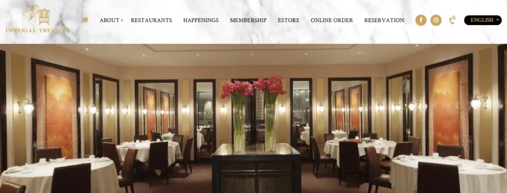 Website banner for Imperial Treasure featuring an elegant Chinese fine dining room set with white-clothed round tables, high-back dark wood chairs, tall pink floral centerpieces, and warm ambient lighting along decorative mirrored walls.