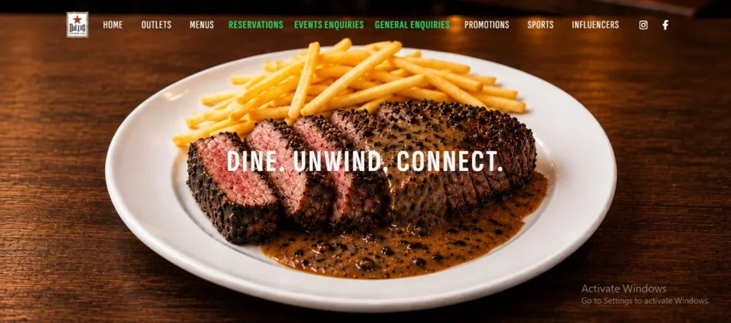 Screenshot of a restaurant website hero banner featuring a white plate with sliced rare steak coated in peppercorn sauce, served alongside golden French fries, with the overlay text reading "DINE. UNWIND. CONNECT."