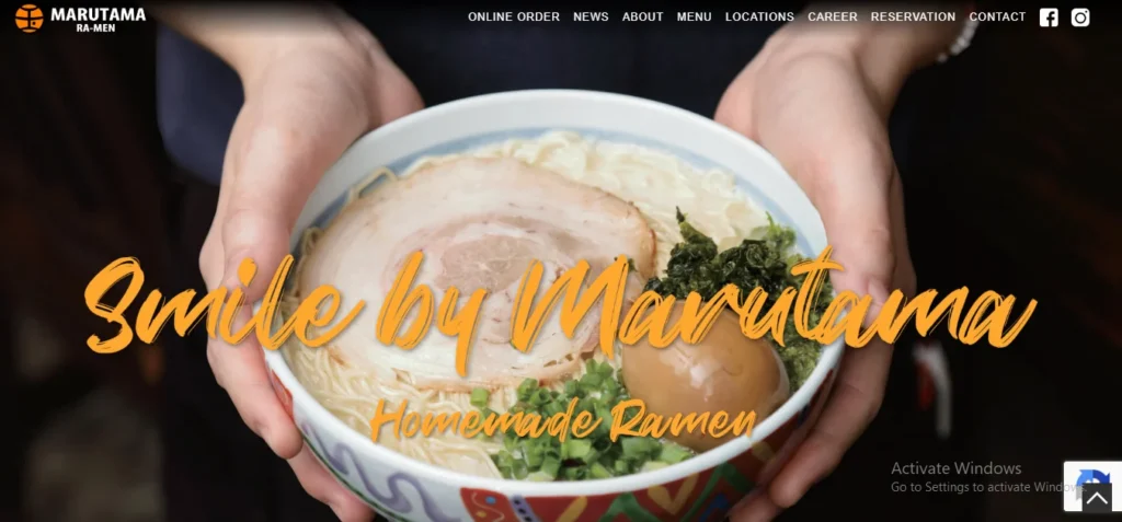 Website homepage banner for Marutama Ra-Men featuring hands holding a bowl of ramen with pork chashu, a seasoned soft-boiled egg, and green onions. Yellow stylized text overlaid across the center reads "Smile by Marutama Homemade Ramen," with the website menu navigation bar visible along the top.