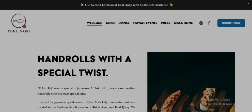 Website page for Toku Nori displaying a top banner that reads "Our Second Location at Boat Quay with Sushi Sets Available." Below the Toku Nori logo and navigation menu, the main section presents bold heading text "HANDROLLS WITH A SPECIAL TWIST." Introductory text explains the meaning of "Toku" (special) in Japanese, alongside a photo on the right showing sushi handrolls resting on wooden serving blocks.