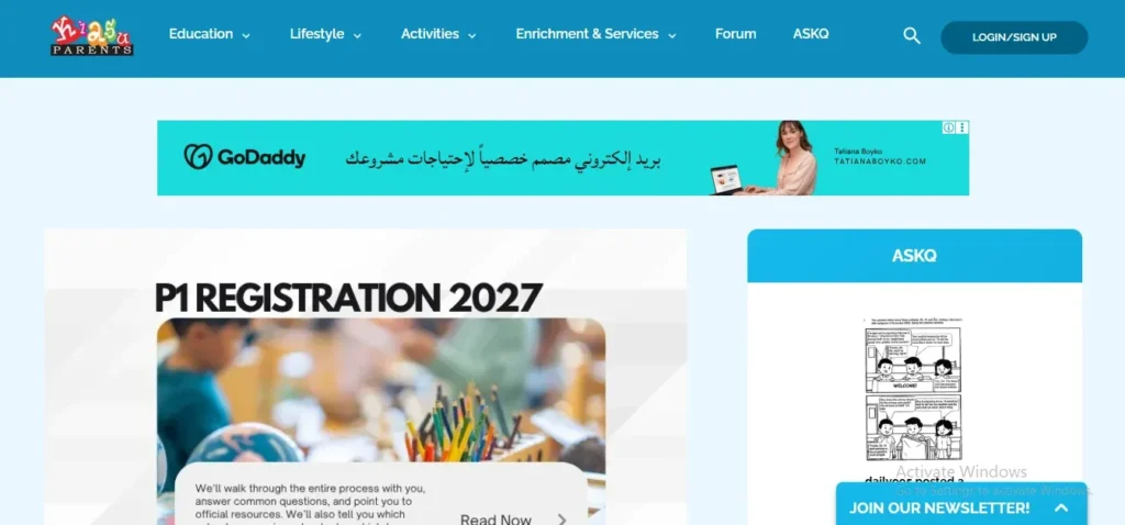Screenshot of the KiasuParents website homepage featuring a top navigation bar with Education and Lifestyle tabs, a GoDaddy advertisement banner, and an article section titled "P1 REGISTRATION 2027".